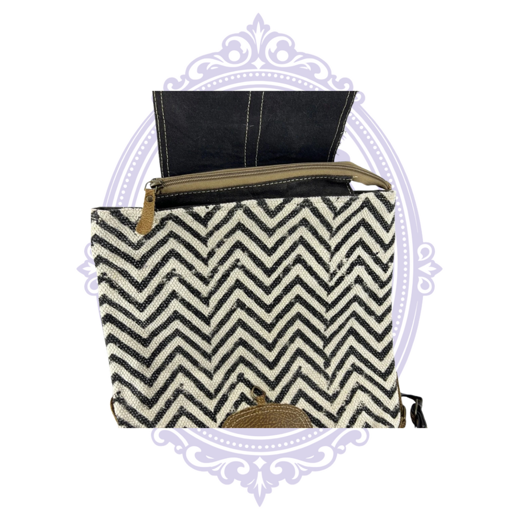 Myra Frost backpack open top zipper and black cream chevron fabric