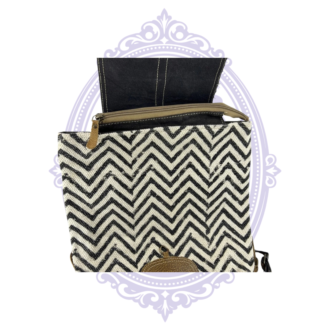 Myra Frost backpack open top zipper and black cream chevron fabric
