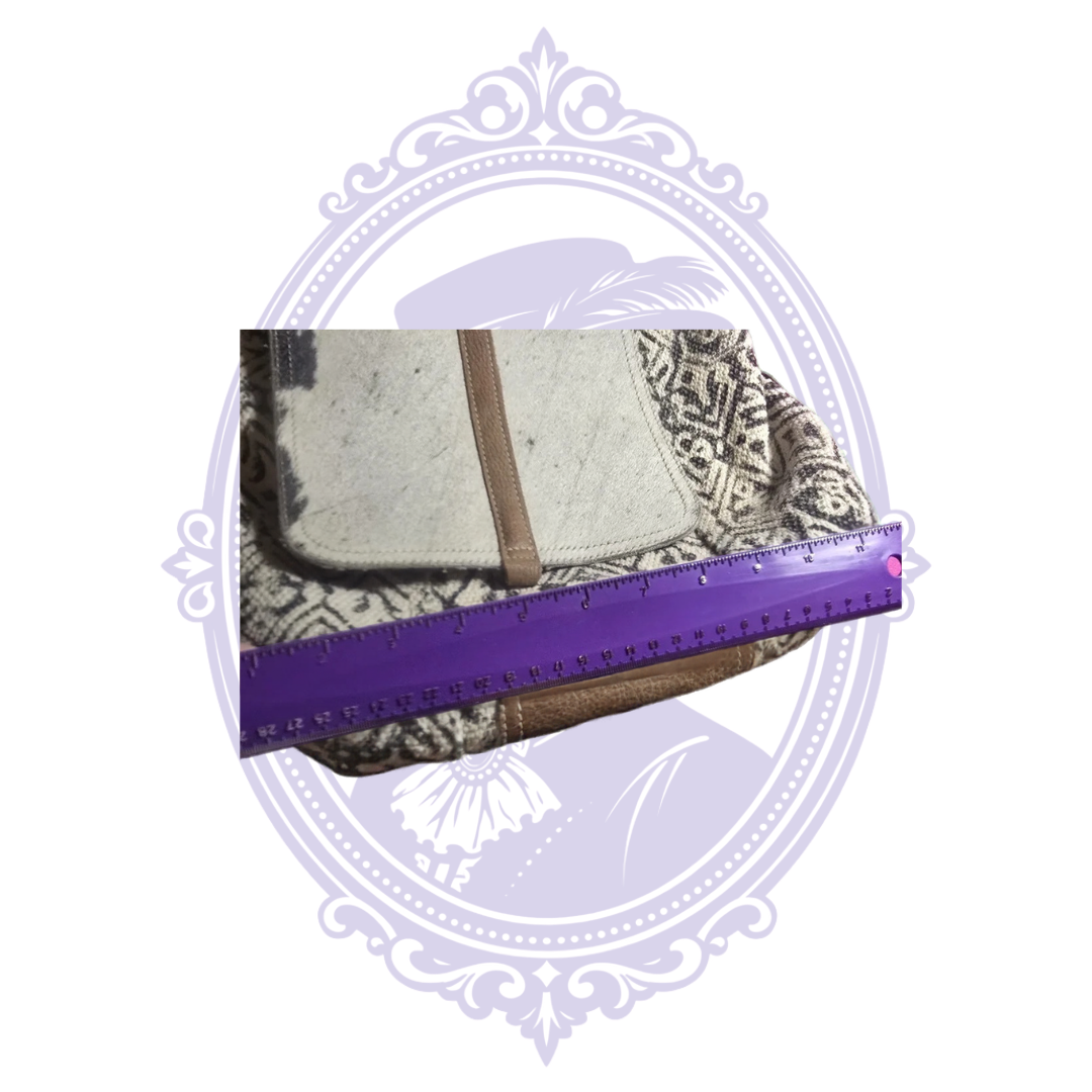 Backpack width measurement with purple ruler