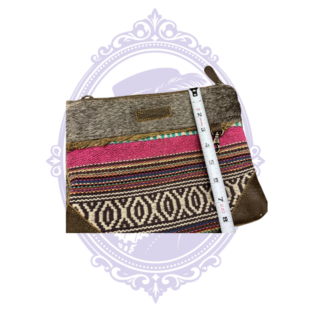 Myra wristlet with measuring tape showing height
