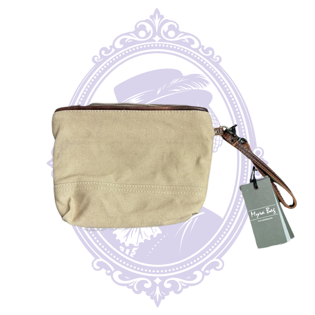 Back view of the Myra Pasty Pouch wristlet showing tan canvas fabric, top zipper, brown wrist strap, and original hangtags.
