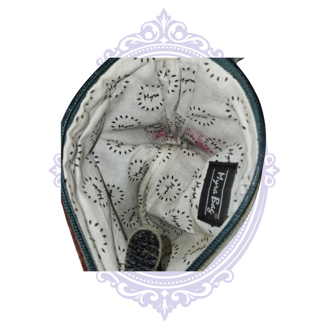 Myra-branded interior lining with visible pink stains