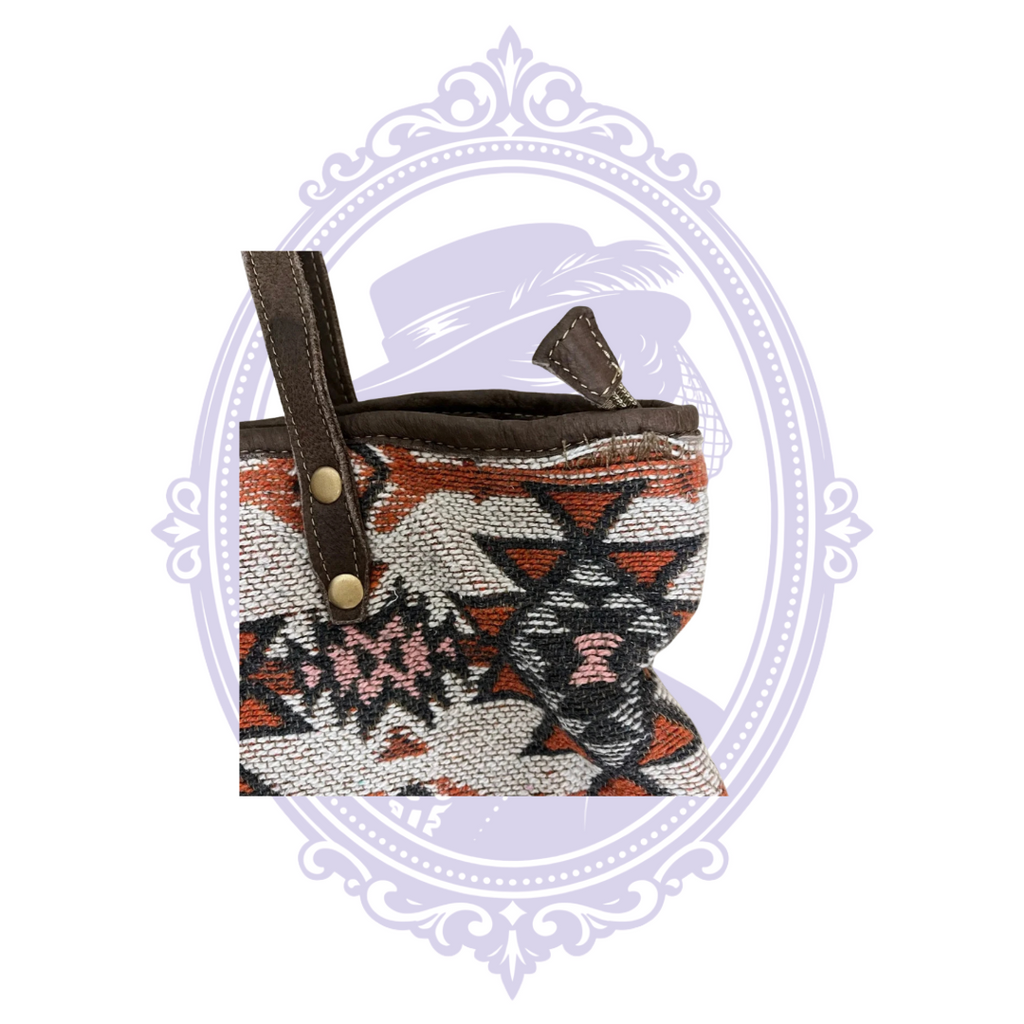 Close-up of wear at upper edge and shoulder strap attachment of Myra tribal tote.