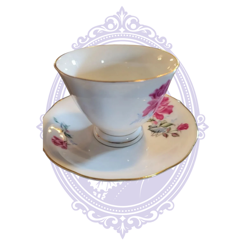 Nanjing Pagoda porcelain teacup and saucer with pink roses and gold trim, front view