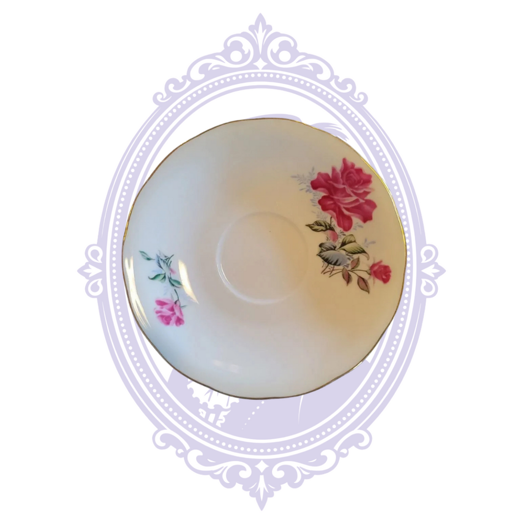 Nanjing saucer showing pink rose floral decoration and gold rim