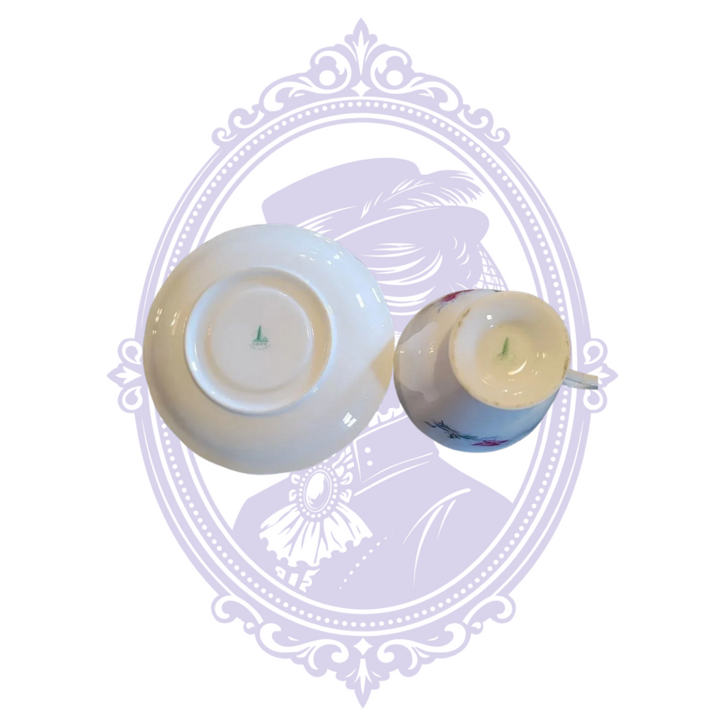 Top view inside white porcelain teacup with gold-trimmed rim