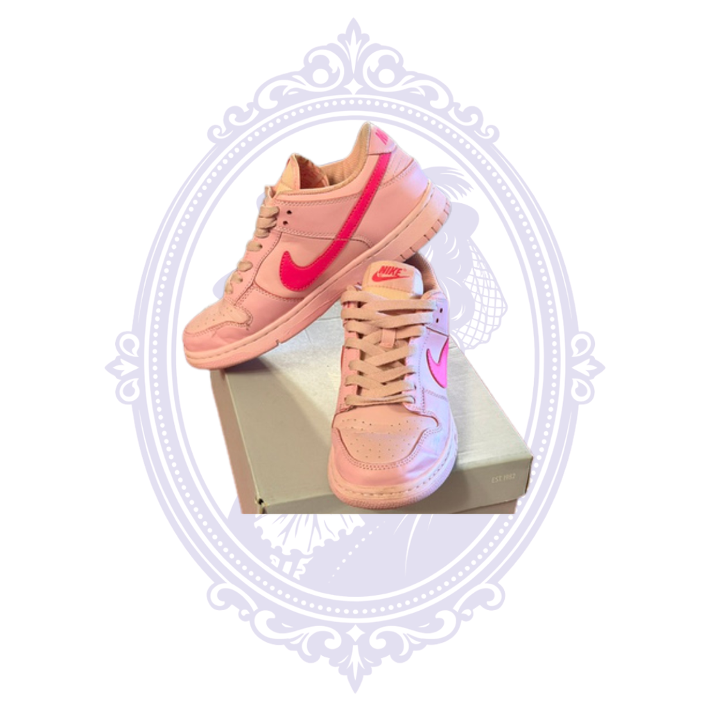 Nike Dunk Low Triple Pink size 7 sneakers displayed at angles showing pink leather uppers and bright pink Nike Swooshes