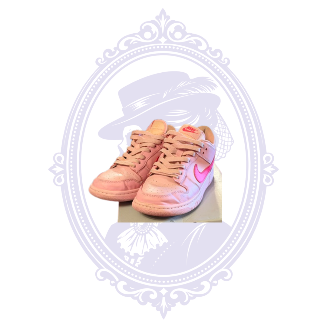 Nike Dunk Low Triple Pink size 7 sneakers shown from the front angle with pink leather uppers and laces