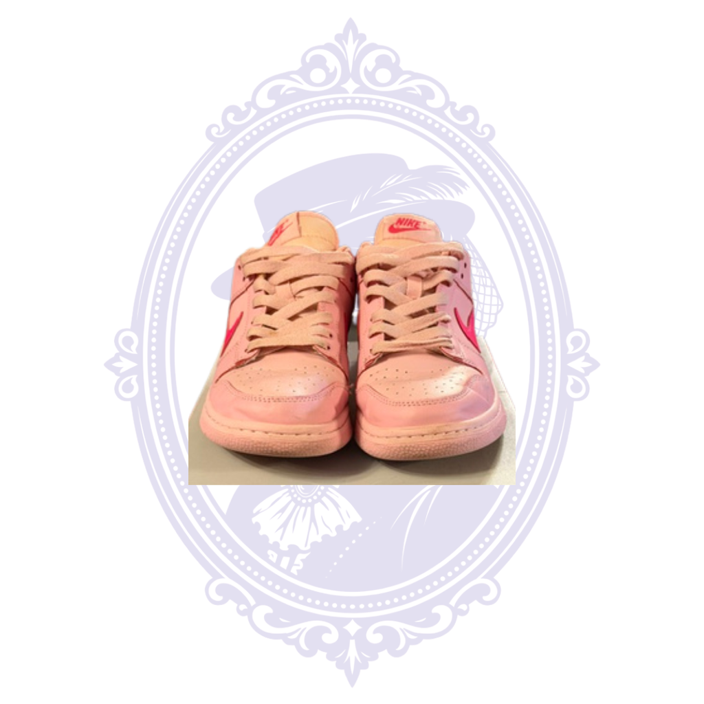 Front view of pre-owned Nike Dunk Low Triple Pink size 7 sneakers showing toe boxes, laces and visible wear