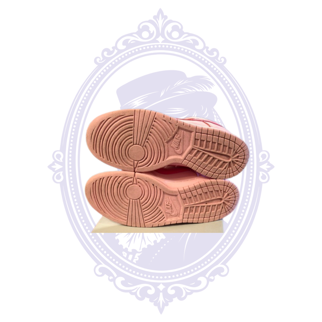 Bottom view of Nike Dunk Low Triple Pink size 7 sneakers showing pink rubber outsoles and remaining tread