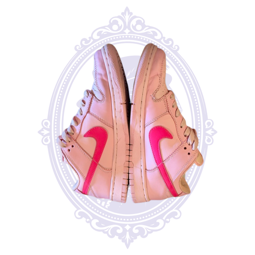 Side view of Nike Dunk Low Triple Pink size 7 sneakers showing tonal pink leather panels and bright pink Swooshes