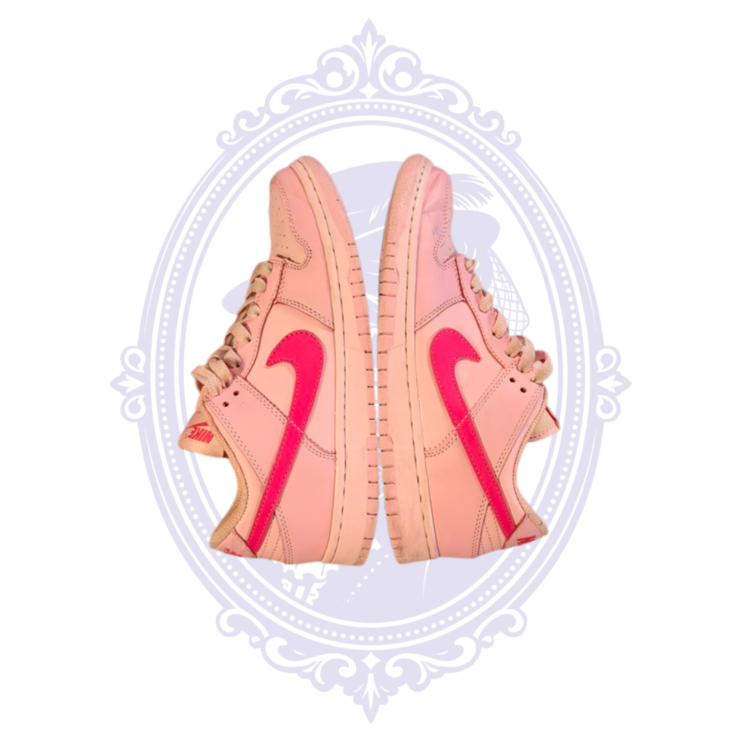 Opposite side view of Nike Dunk Low Triple Pink size 7 sneakers showing pink leather construction and Nike Swooshes