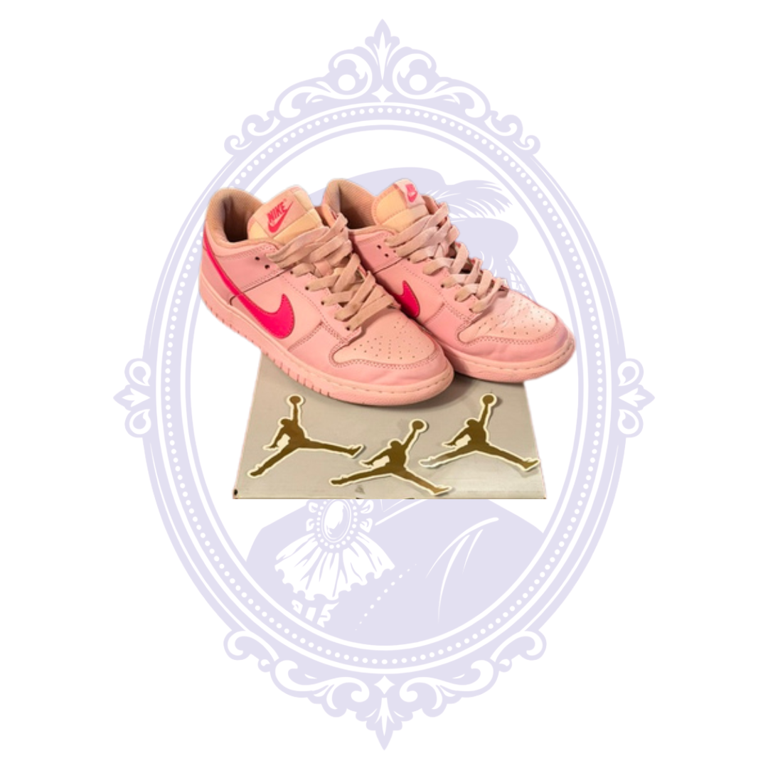 Pre-owned Nike Dunk Low Triple Pink size 7 sneakers displayed with three unused gold Jumpman stickers included with the pair
