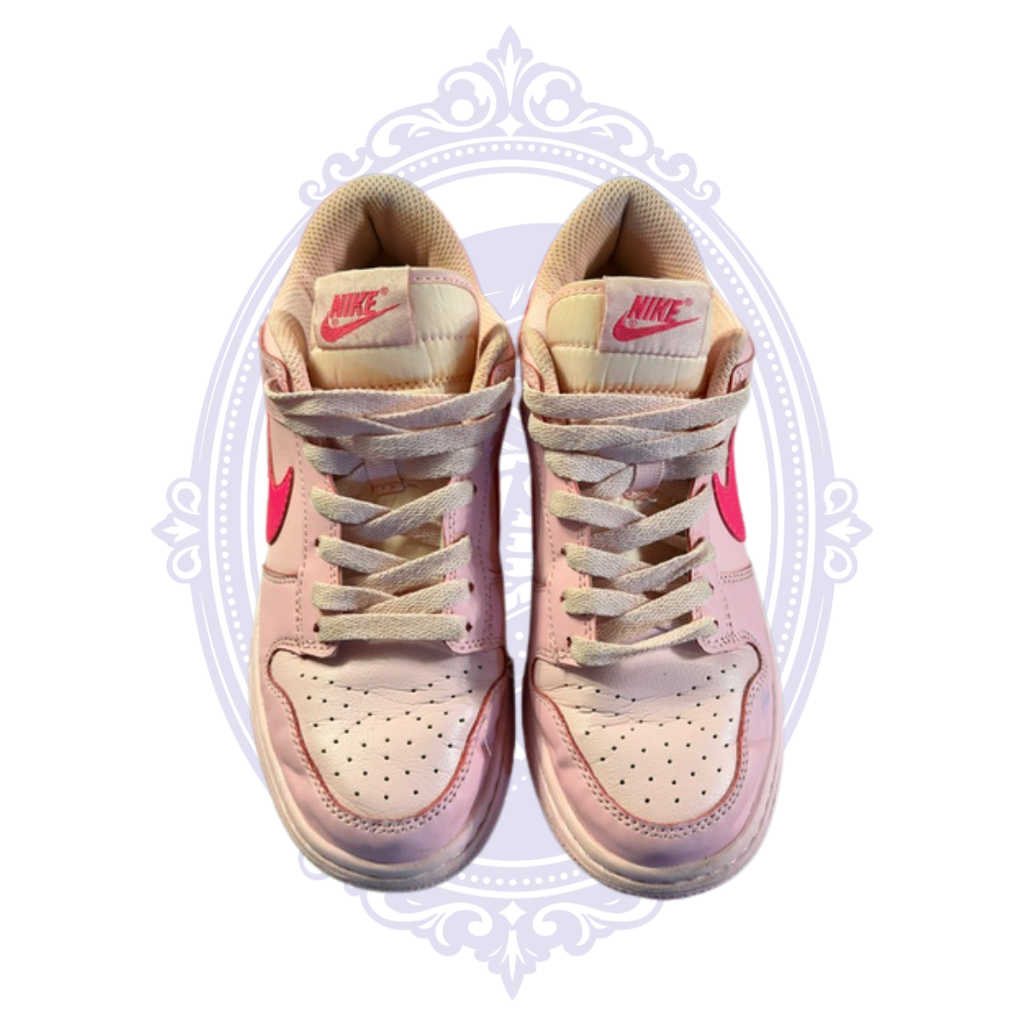 Close overhead view of Nike Dunk Low Triple Pink size 7 sneakers showing laces, perforated toe boxes and pre-owned condition