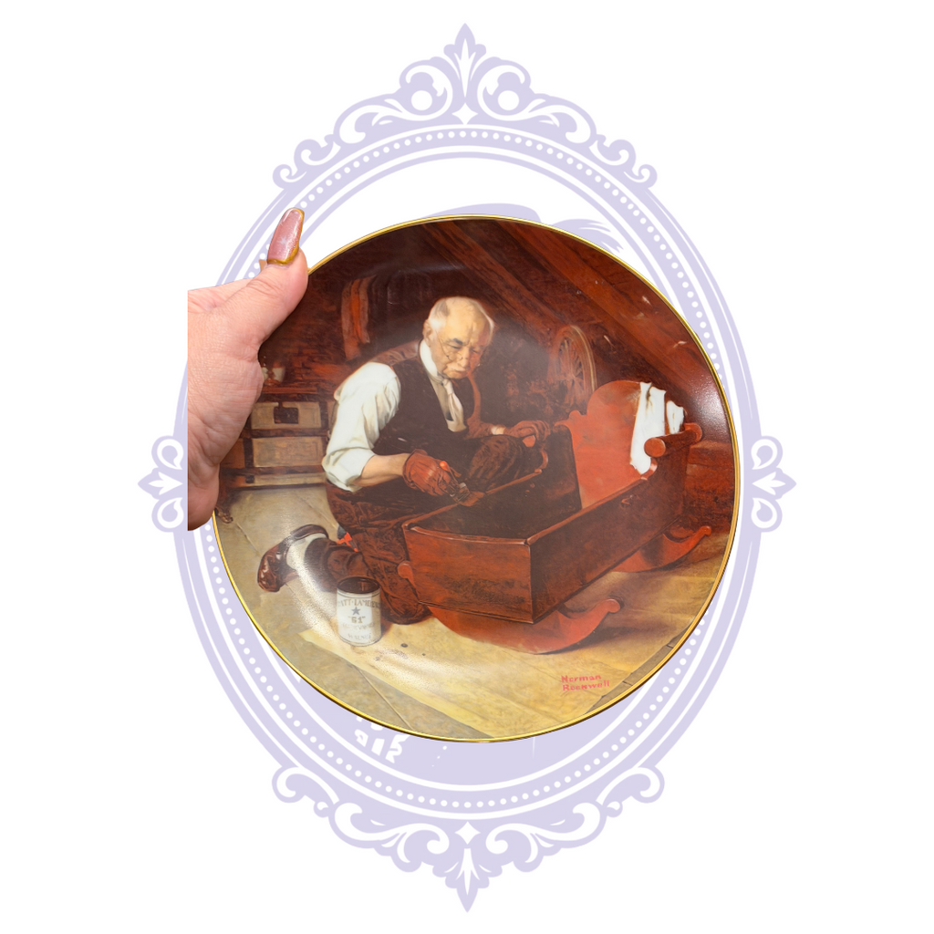 Norman Rockwell Grandpa's Gift collector plate with grandfather working on a wooden cradle