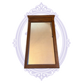 Front view of oak-tone framed rectangular wall mirror on pale lavender decorative backdrop
