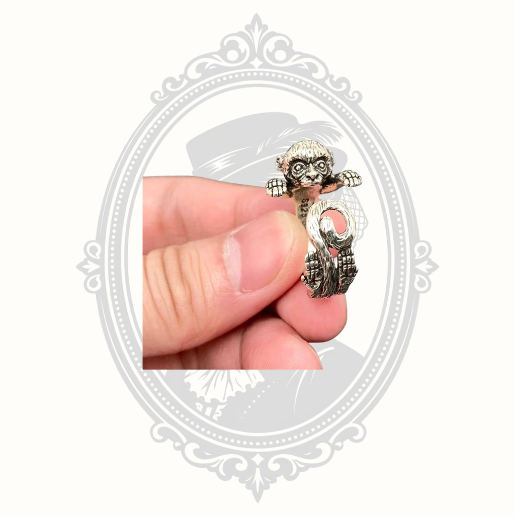 Peekaboo monkey adjustable silver-tone wrap ring.