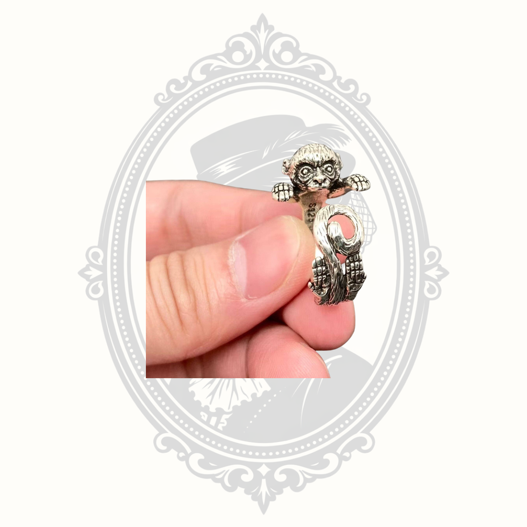 Peekaboo monkey adjustable silver-tone wrap ring.