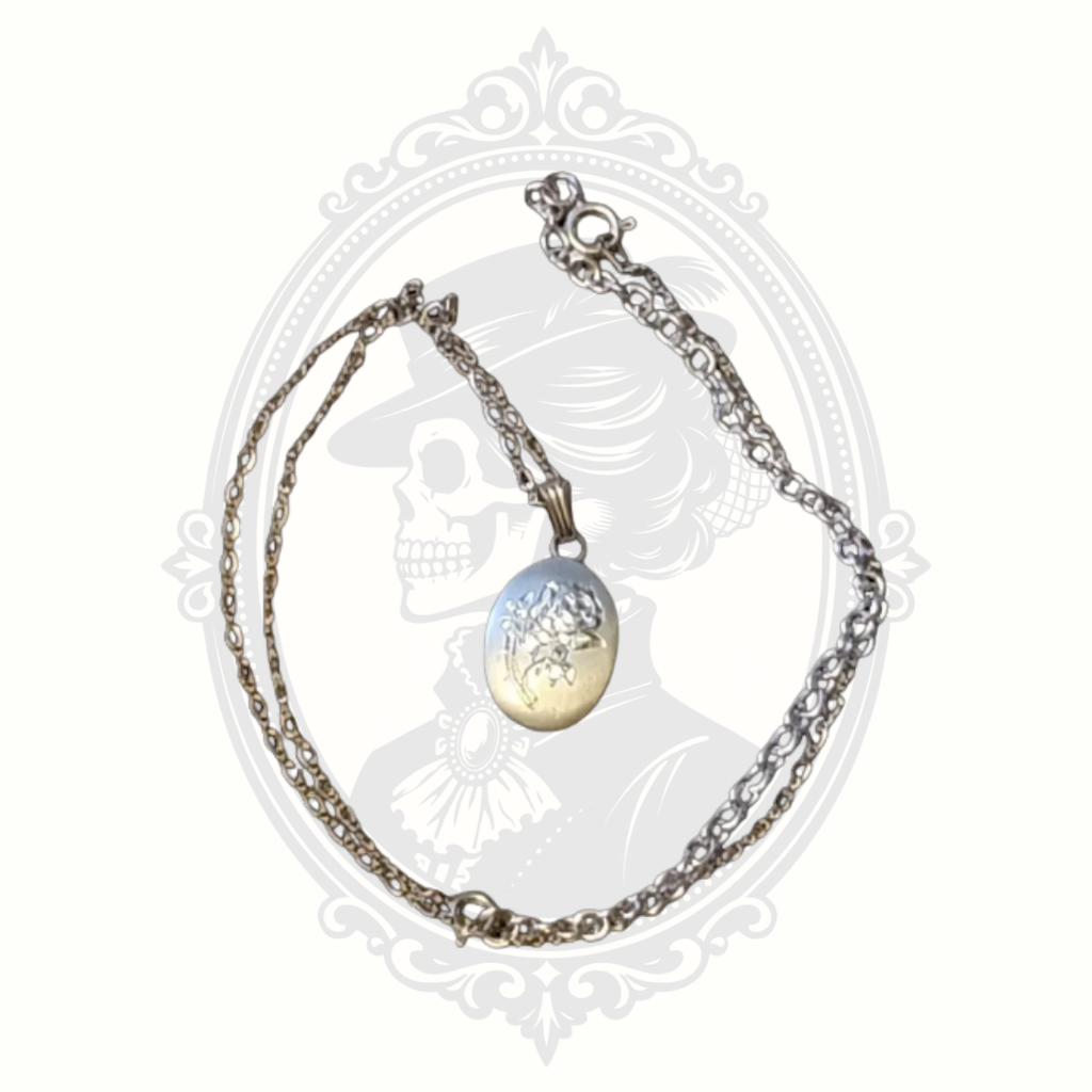 Vintage pewter rose pendant necklace with chain and extender displayed on neutral background
