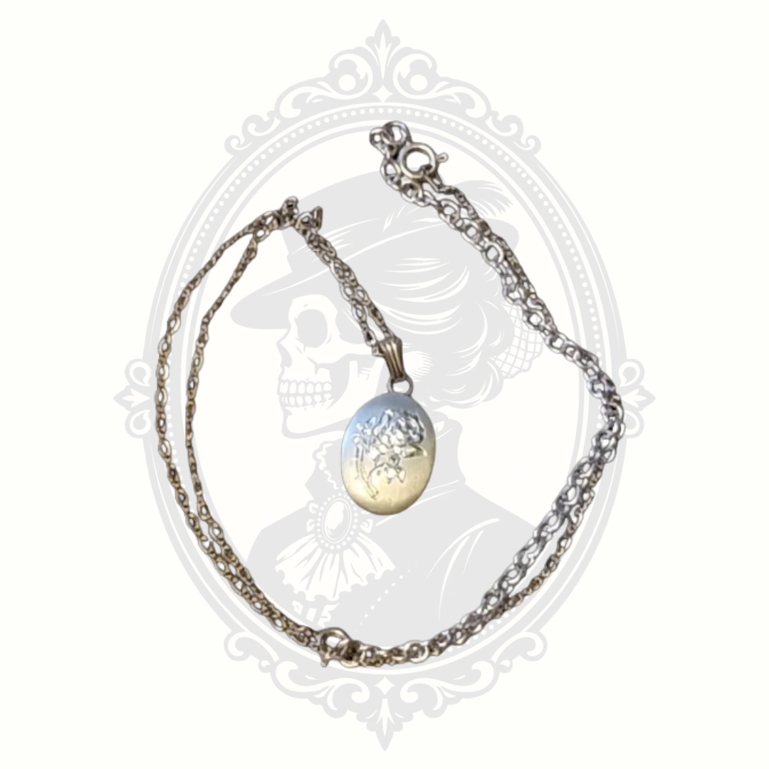 Vintage pewter rose pendant necklace with chain and extender displayed on neutral background