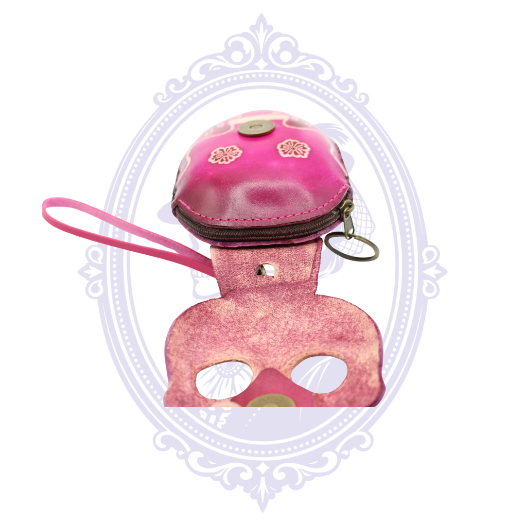 Open pink leather sugar skull coin purse showing the zippered compartment, wrist strap and key ring.