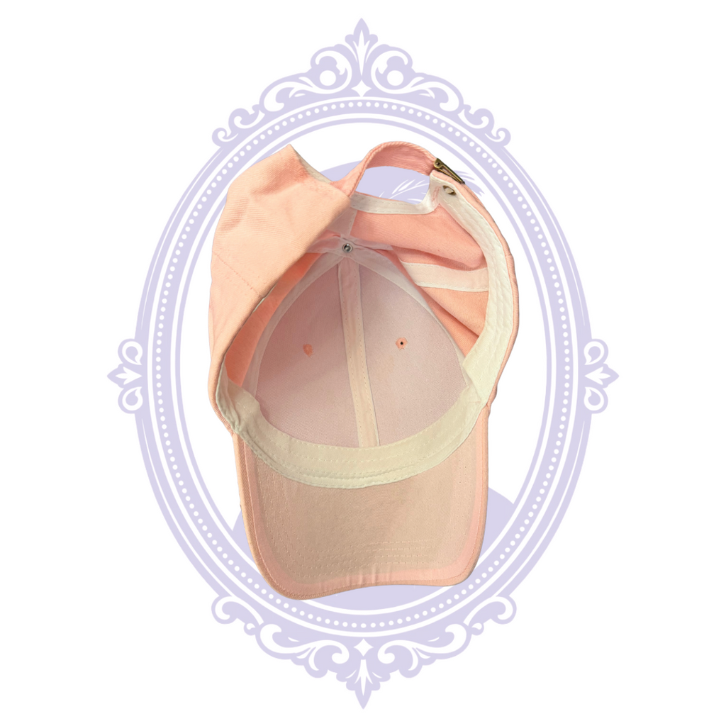 Underside of pink baseball cap brim and inner sweatband