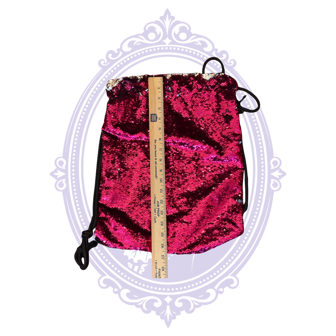 Black fabric reverse of hot pink sequin drawstring backpack