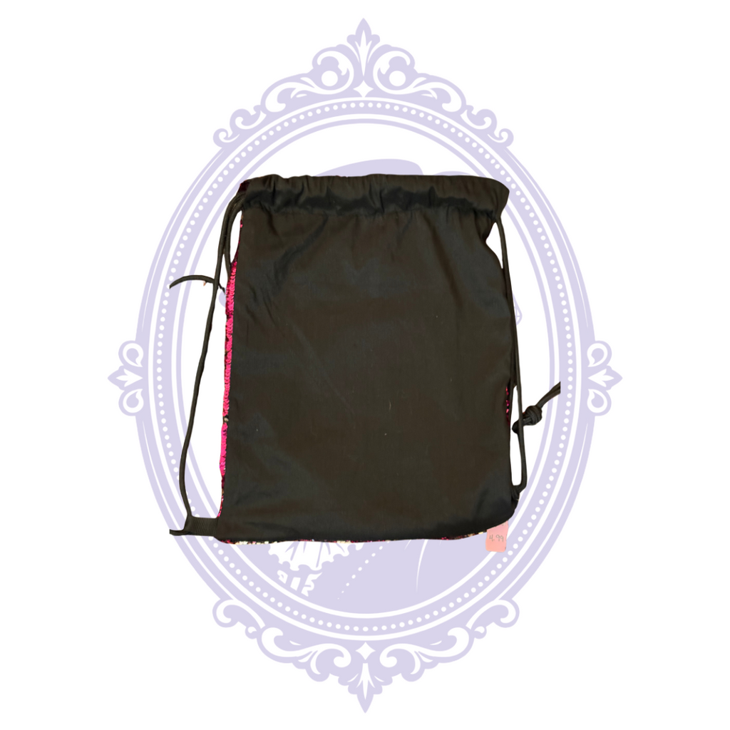 Height of hot pink sequin drawstring backpack shown with ruler