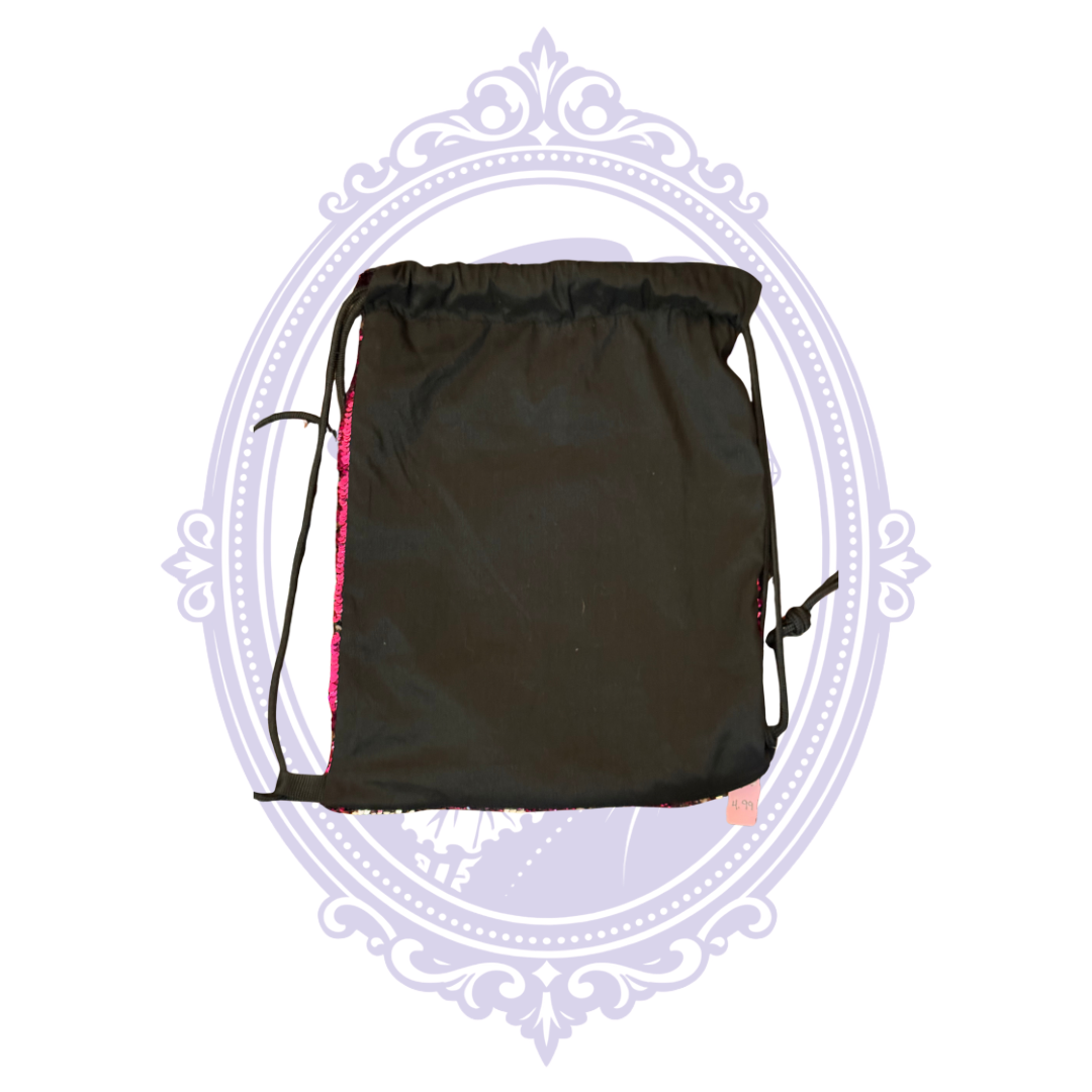 Height of hot pink sequin drawstring backpack shown with ruler