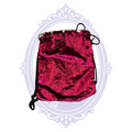 Width of hot pink sequin drawstring backpack shown with ruler