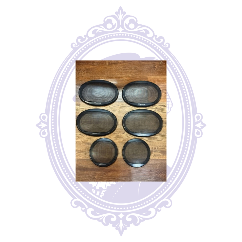 Front views of six black Pioneer speaker grilles, four oval and two round