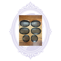 Front views of six black Pioneer speaker grilles, four oval and two round