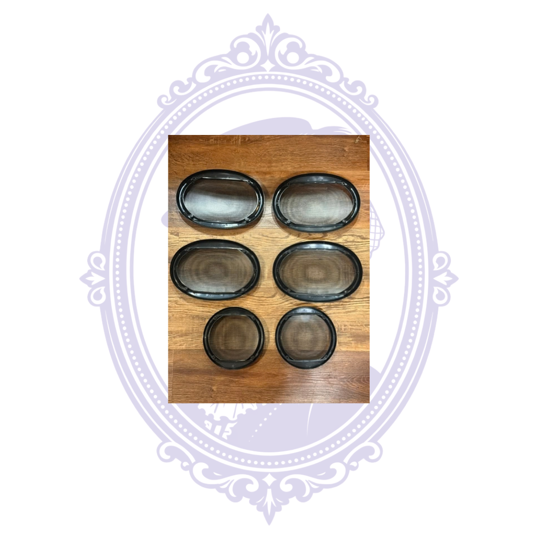 Reverse sides of six black Pioneer speaker grilles arranged on wood