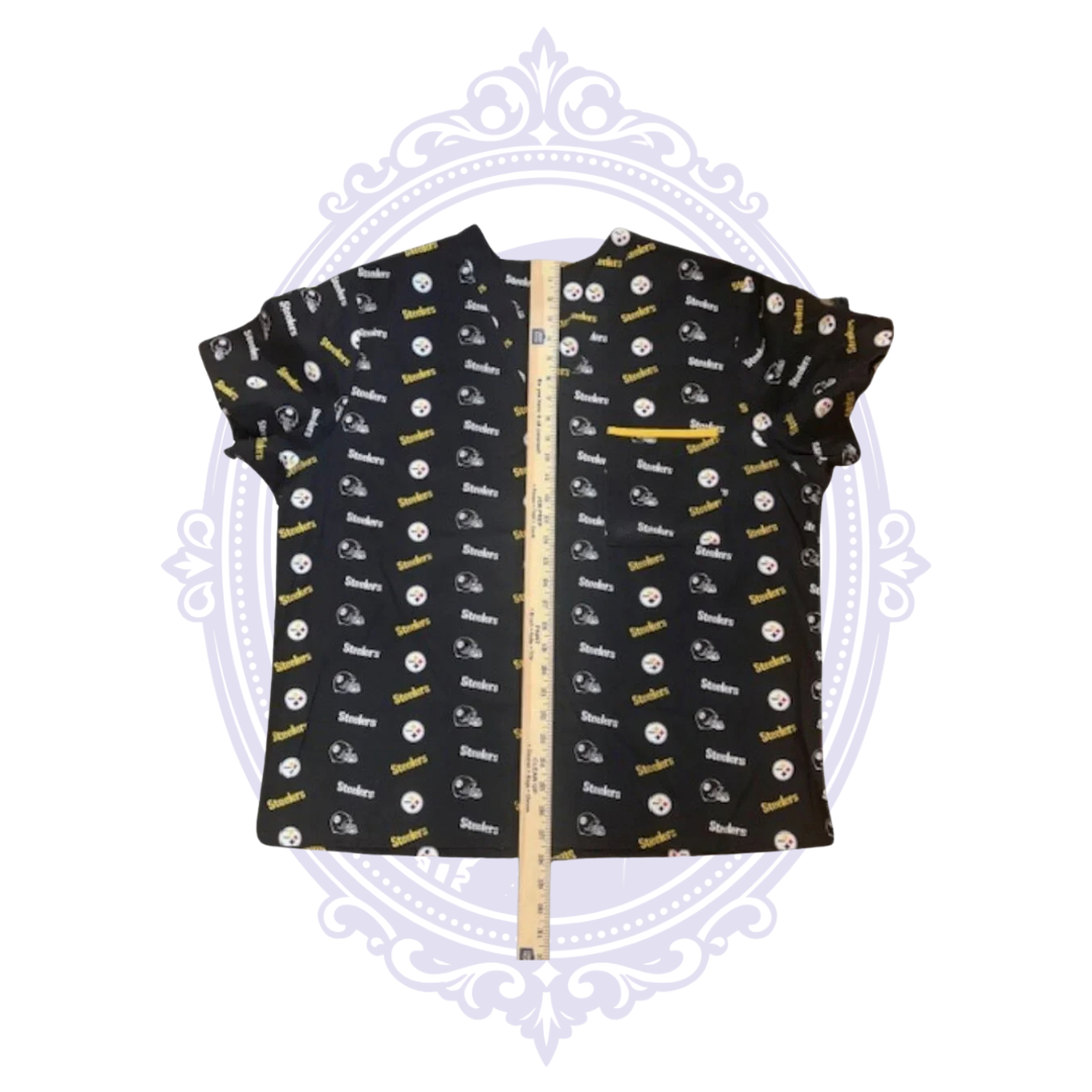 Pittsburgh Steelers black and gold women’s scrub top shown with ruler from neckline to hem for length measurement.