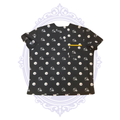 Front view of black Pittsburgh Steelers women’s scrub top with repeating helmet and team logos and gold-trimmed chest pocket.