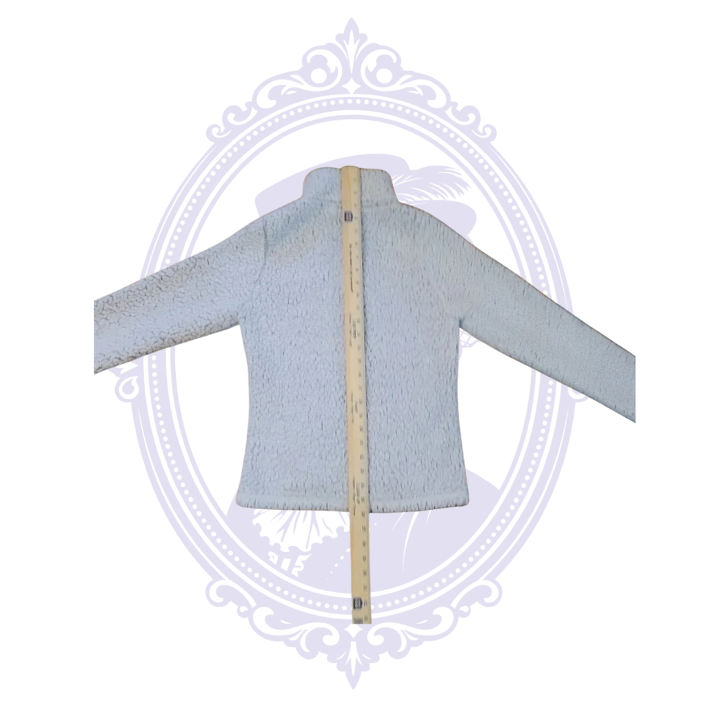 Back of Pittsburgh Steelers sherpa fleece jacket shown with ruler for length measurement.