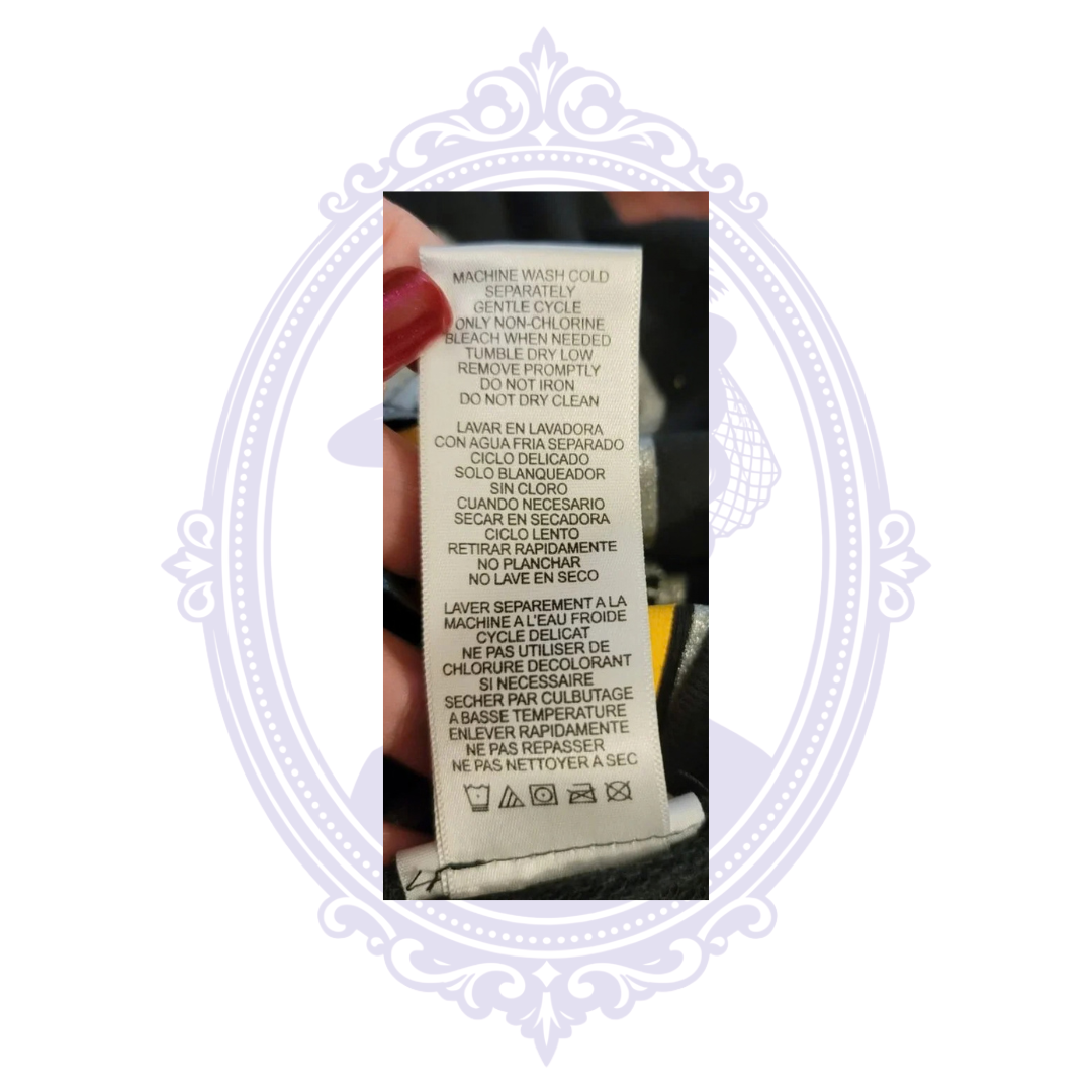 Care label for Pittsburgh Steelers NFL Teens long-sleeve shirt with washing instructions.