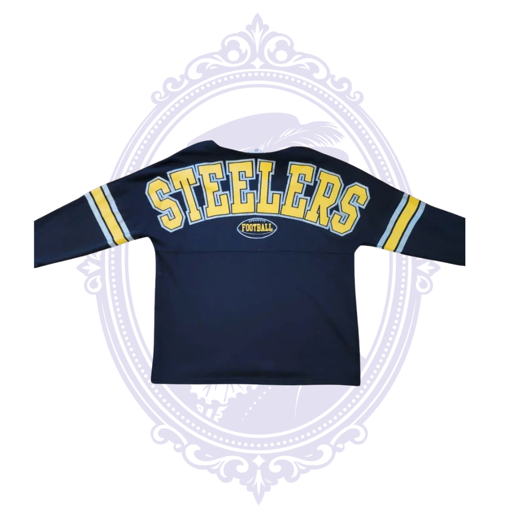 Close view of large Steelers Football graphic across back of black NFL Teens shirt.