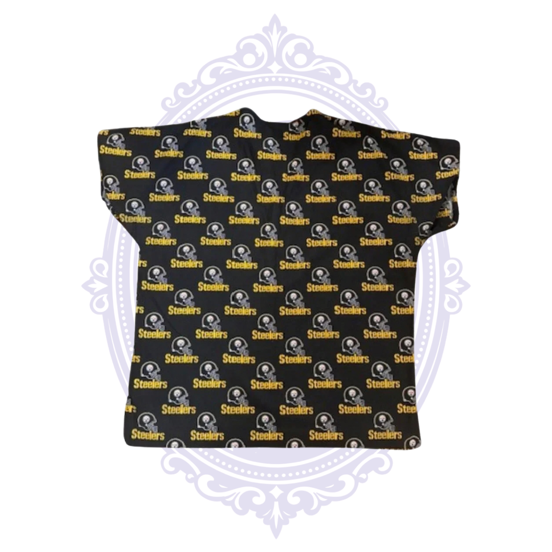 Back view of Pittsburgh Steelers black scrub top with repeating helmet logos and gold Steelers wordmarks.