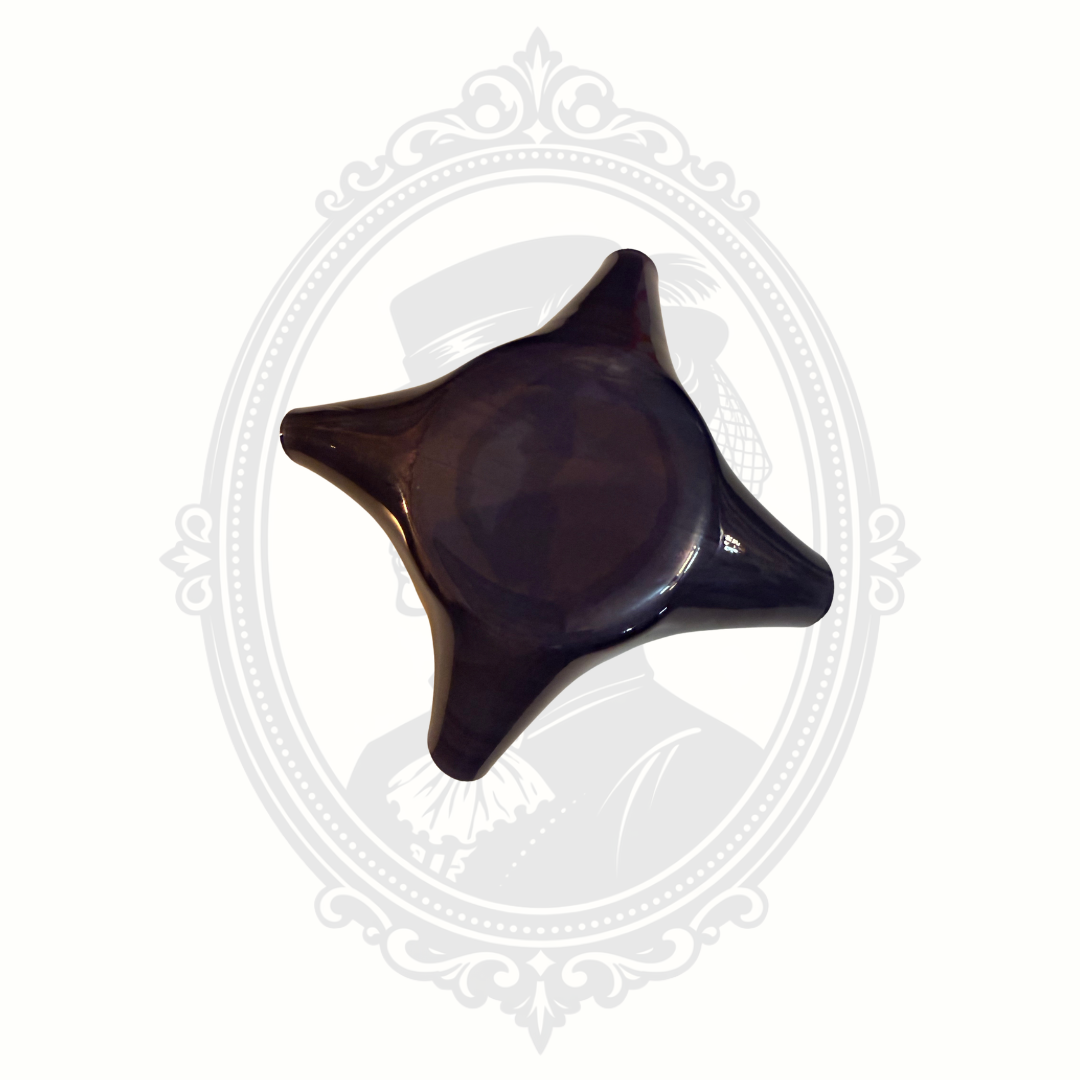 Bottom view of purple art glass bowl with scalloped edges and iridescent decorative finish.