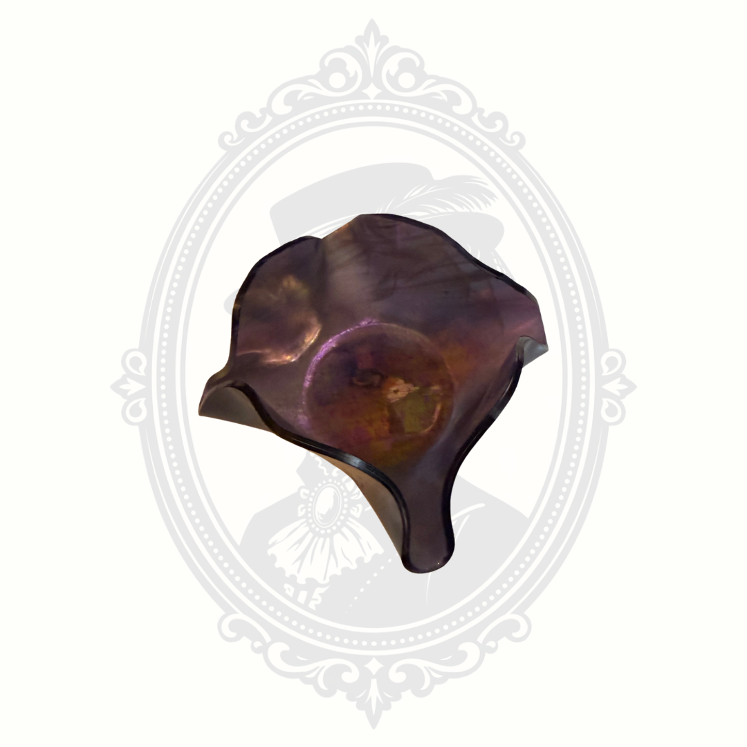 Interior view of purple glass ruffle bowl with iridescent finish and scalloped decorative edges.