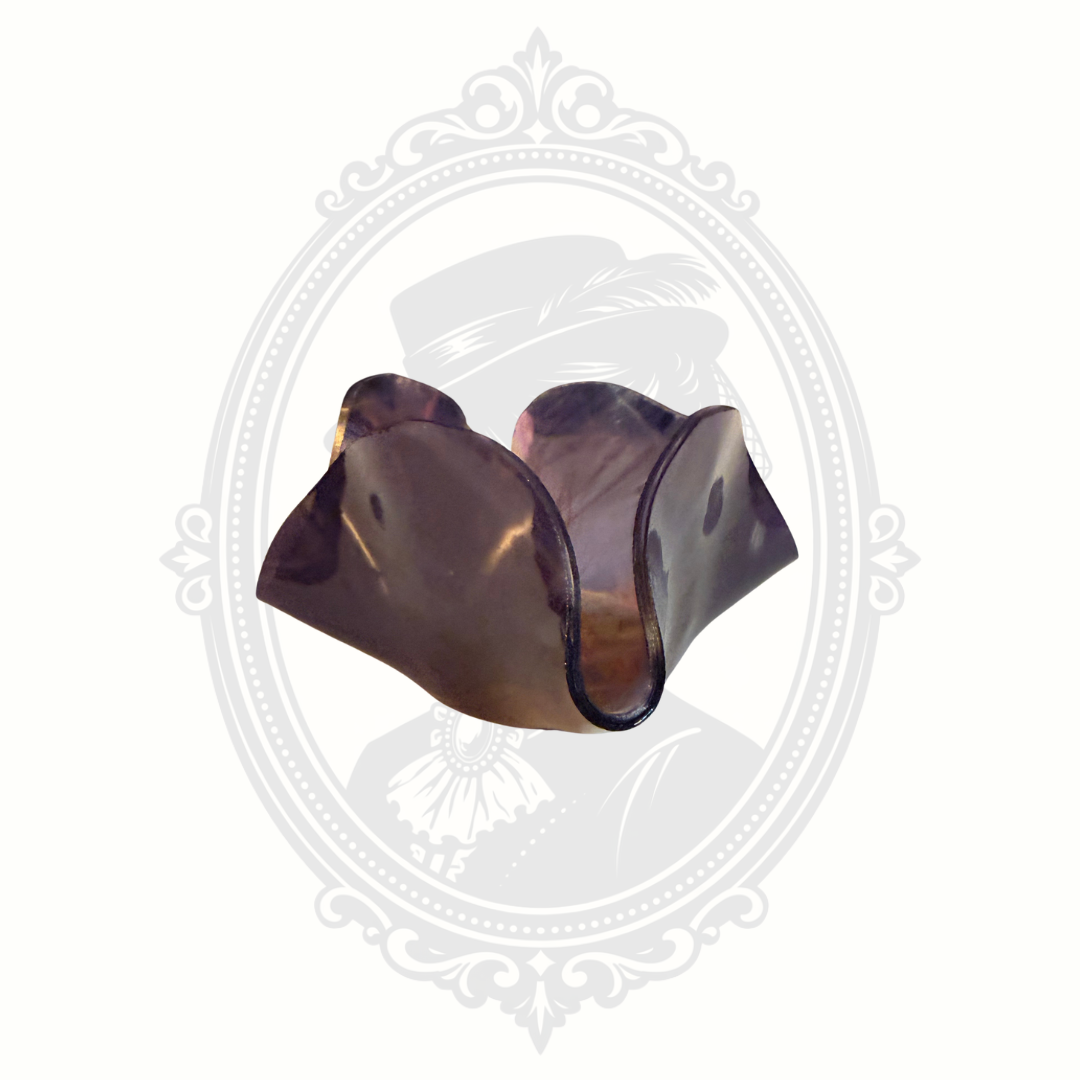Side view of purple iridescent art glass bowl with ruffled edge and reflective carnival glass styling.