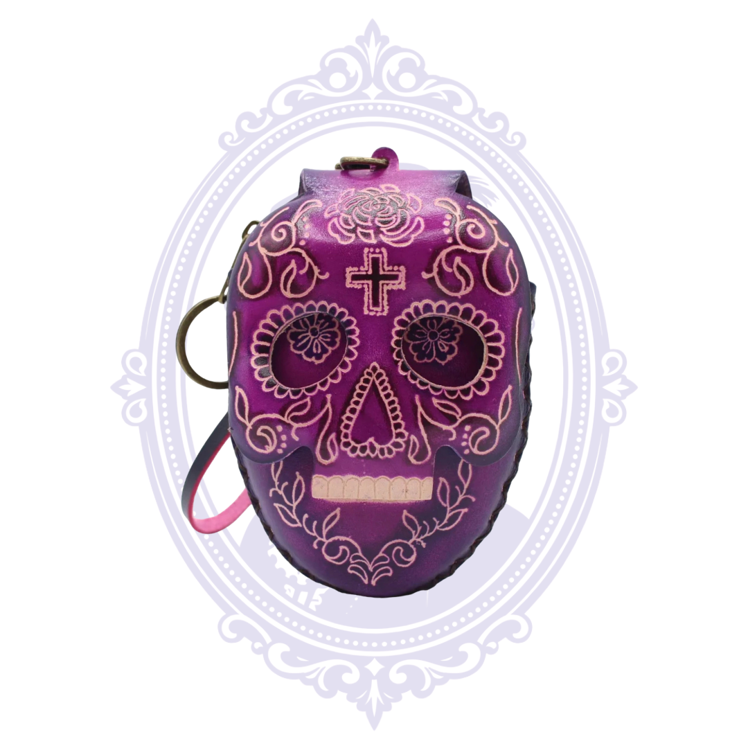 Purple leather sugar skull coin purse with floral skull design, wrist strap and key ring.