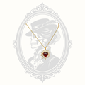 Full view of the gold plated necklace displaying the radiant red heart pendant.