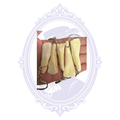 Five real bison tooth keychains showing natural variations in size, shape and color in Mrs. Bones Curio Cupboard inventory.