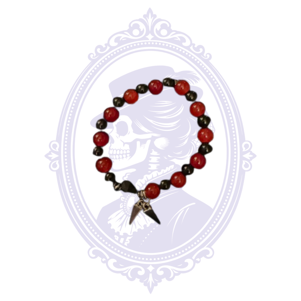 Cupboard Crafted bracelet with alternating red and black beads and two pointed spike charms.