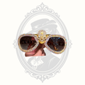Gold iridescent rhinestone skull oversized cat eye sunglasses