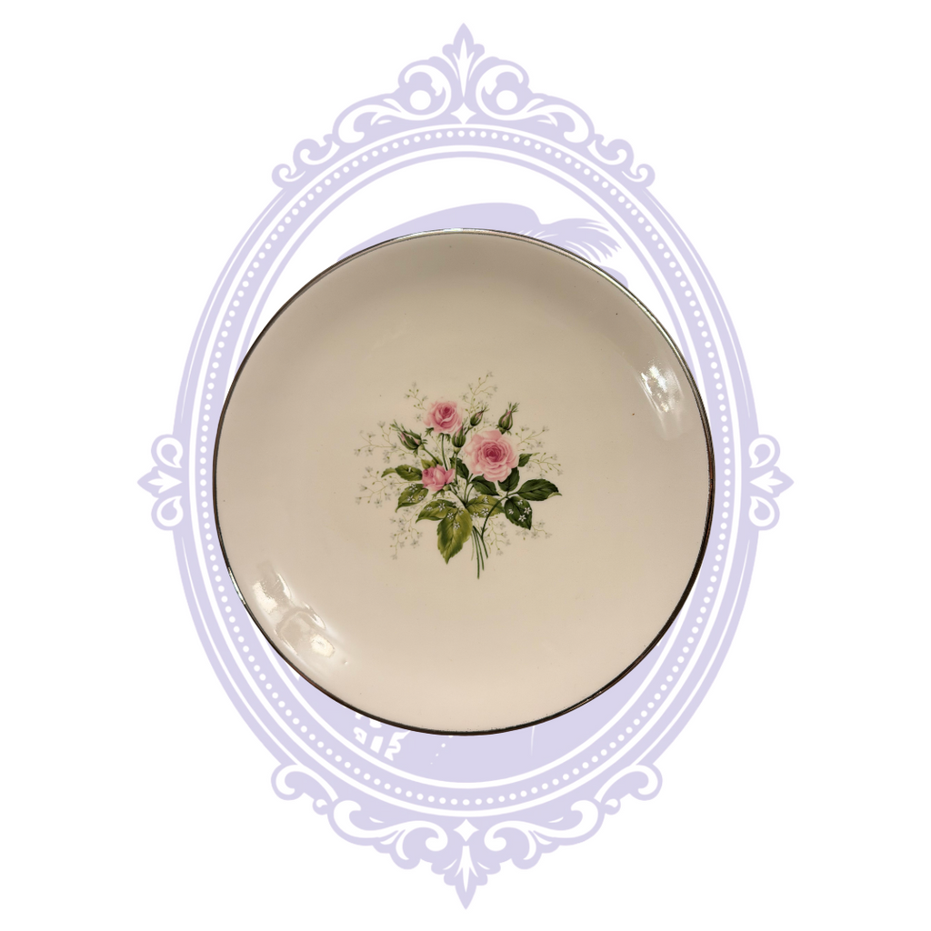 Front of cream china plate with pink rose bouquet and platinum rim