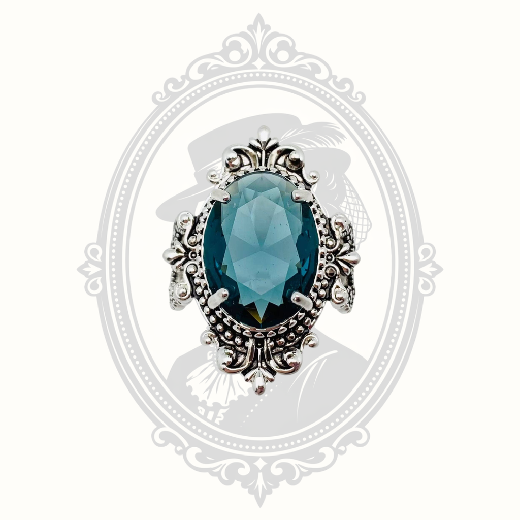 Top view of the sea blue faceted glass statement ring.