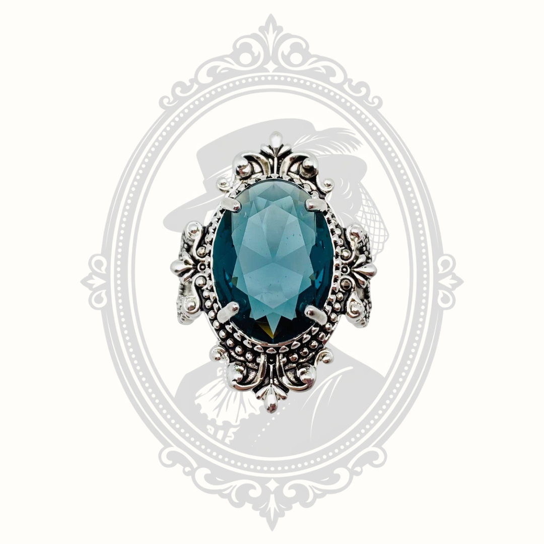 Top view of the sea blue faceted glass statement ring.